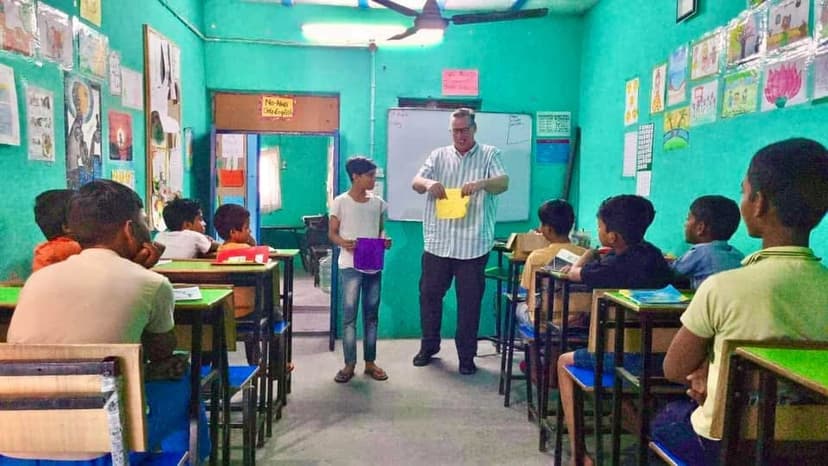 Eric Thompson brings his magical charm to a vibrant classroom full of eager young students, turning what looks like a typical school day into an unforgettable show that has everyone's attention.