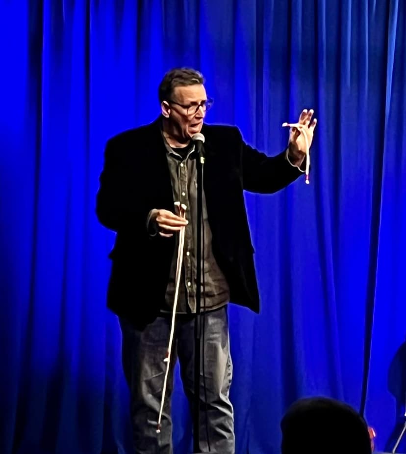 Eric Thompson commands the stage with animated gestures and infectious energy, working his magic on yet another delighted audience from behind the microphone.