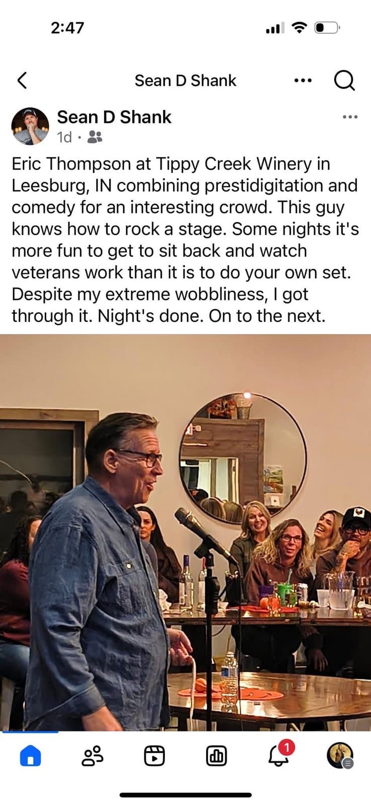 Eric Thompson commands the room at an intimate winery venue, delivering his signature blend of comedy and magic to a delighted audience gathered around the bar.