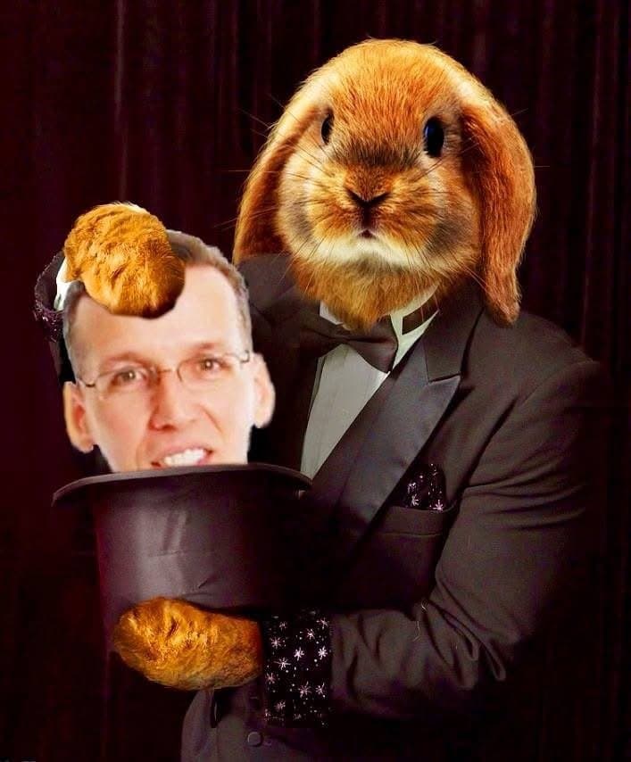 Eric Thompson brings his signature blend of comedy and magic to life, sporting a whimsical rabbit mask while pulling off what appears to be his most 'hare-raising' trick yet with a classic top hat.