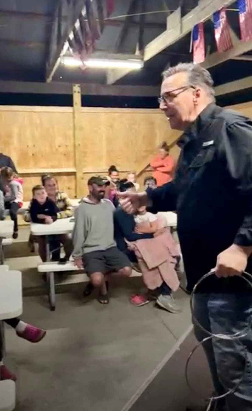 Eric Thompson captivates a lively audience in what appears to be a casual dining venue, working his magic with his signature blend of comedy and showmanship. The entertainer has the crowd's full attention as he delivers another memorable performance in an intimate setting.