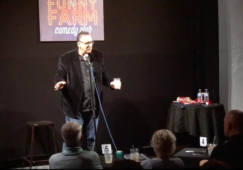 Eric Thompson commands the stage at the Funny Farm Comedy Club, delivering his signature blend of humor to an intimate audience of comedy lovers.