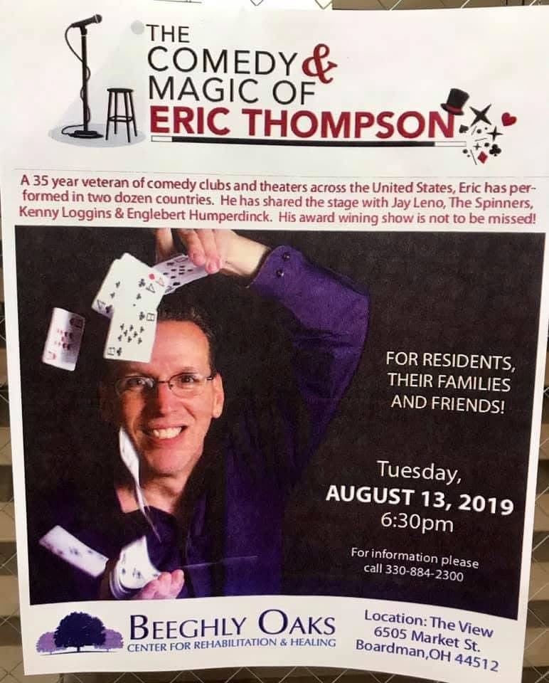 Eric Thompson showcases his magical prowess in this promotional shot, cards cascading through the air as he grins behind his signature glasses, perfectly capturing the blend of comedy and magic that has made him a favorite performer for over three decades.