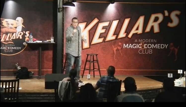 Eric Thompson commands the stage at Kellar's Modern Magic Comedy Club, delivering his signature blend of humor and magic to an intimate audience gathered around candlelit tables.