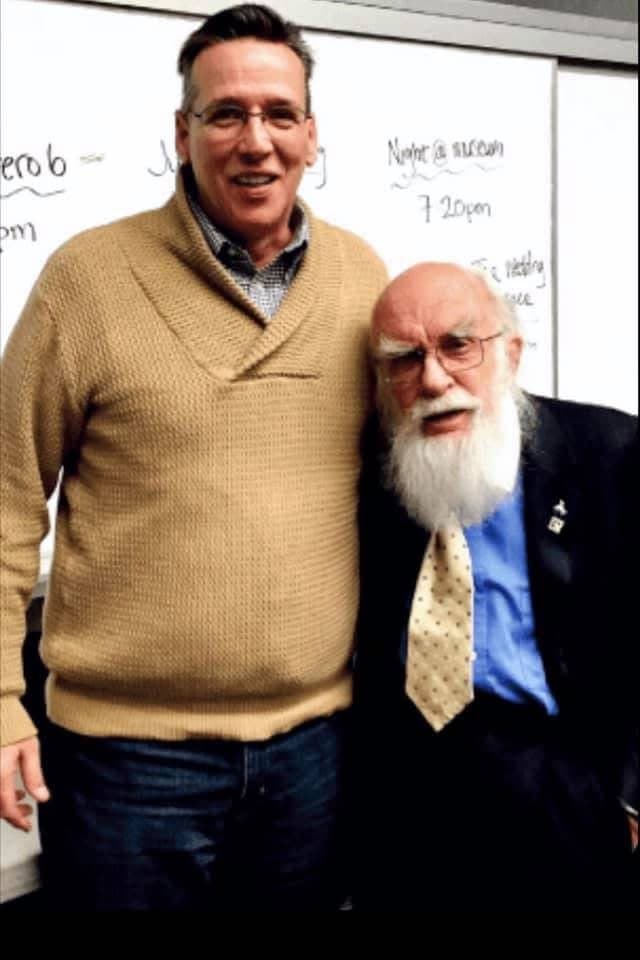 Eric Thompson shares a warm moment with an elderly gentleman, likely after a memorable performance that brought smiles to both generations.