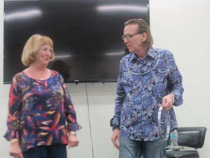 Eric Thompson chats with an audience member during what appears to be a casual meet and greet, showcasing the personal connection he brings to every performance.