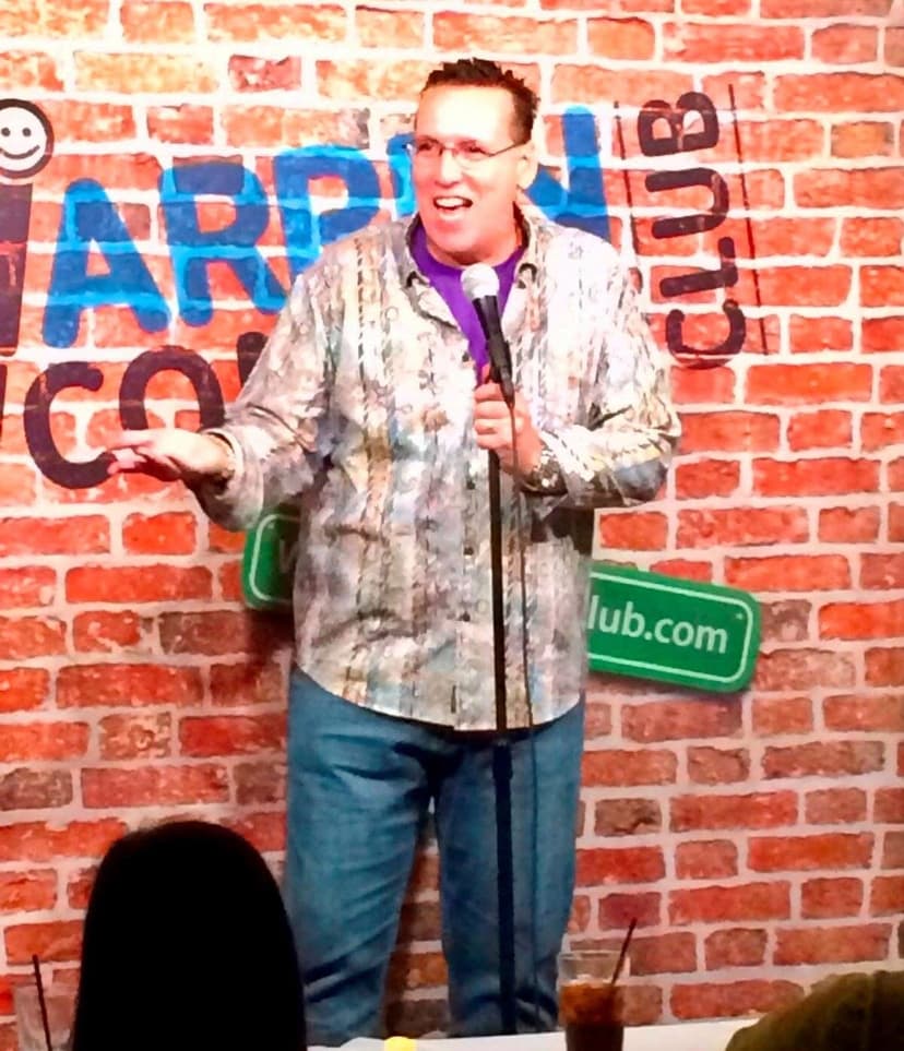 Eric Thompson takes the stage at Arlington Comedy Club, delivering his signature blend of humor and charm to another captivated audience in this intimate brick-walled venue.