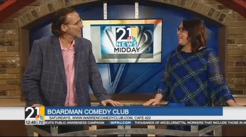 Eric Thompson brings his comedic charm to the morning news, sharing laughs with the anchor during what appears to be a lively interview about his upcoming comedy shows.