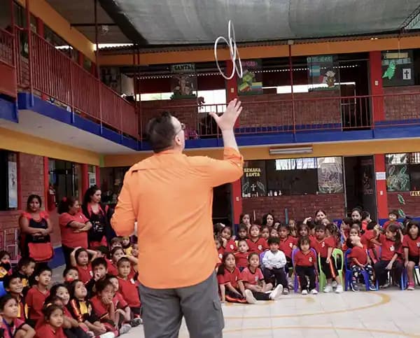 Children laughing during one of Eric Thompson's international shows